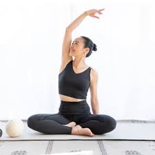 Kaoru stretching on a mat
